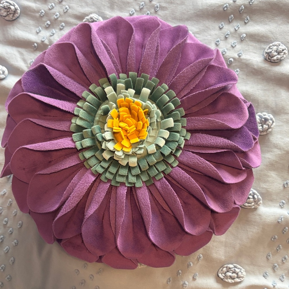 Round Purple Floral Appliqué Pillow with Green and Yellow Center